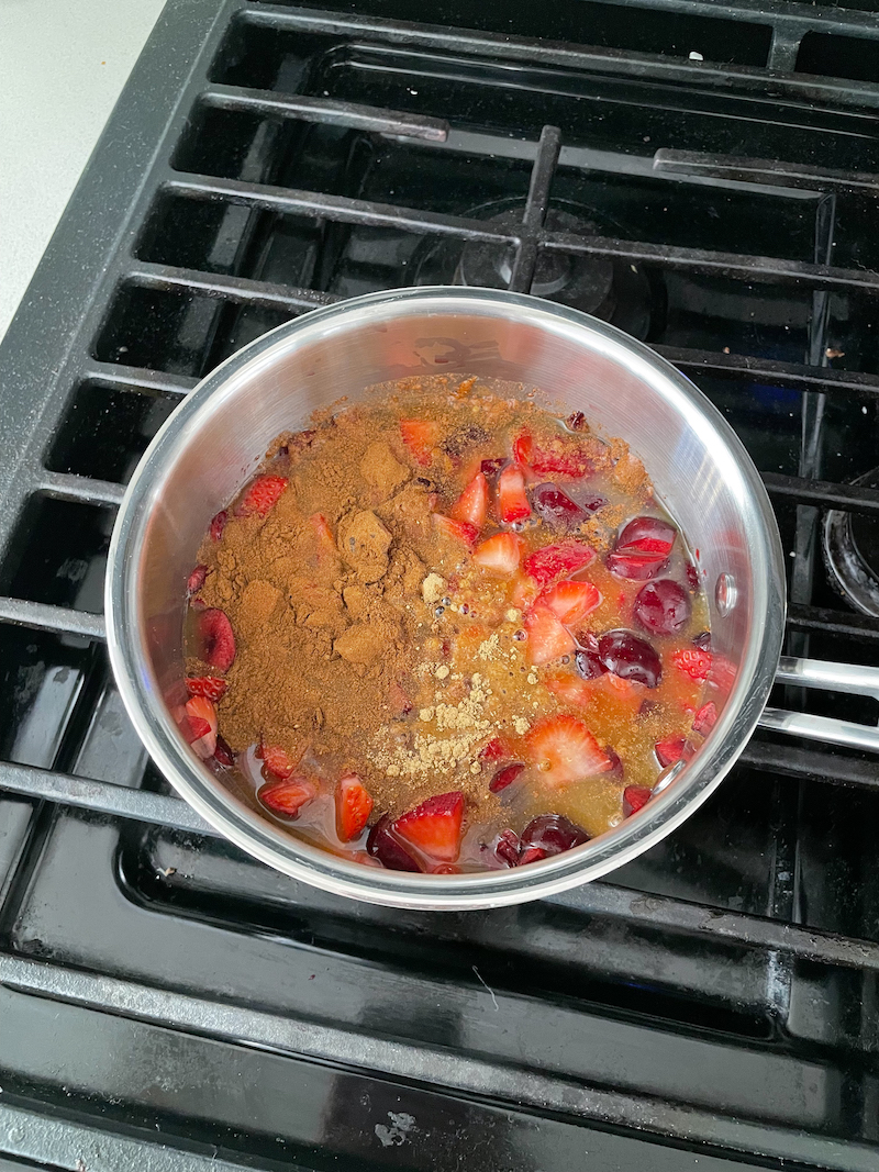 berry compote mixing on stove